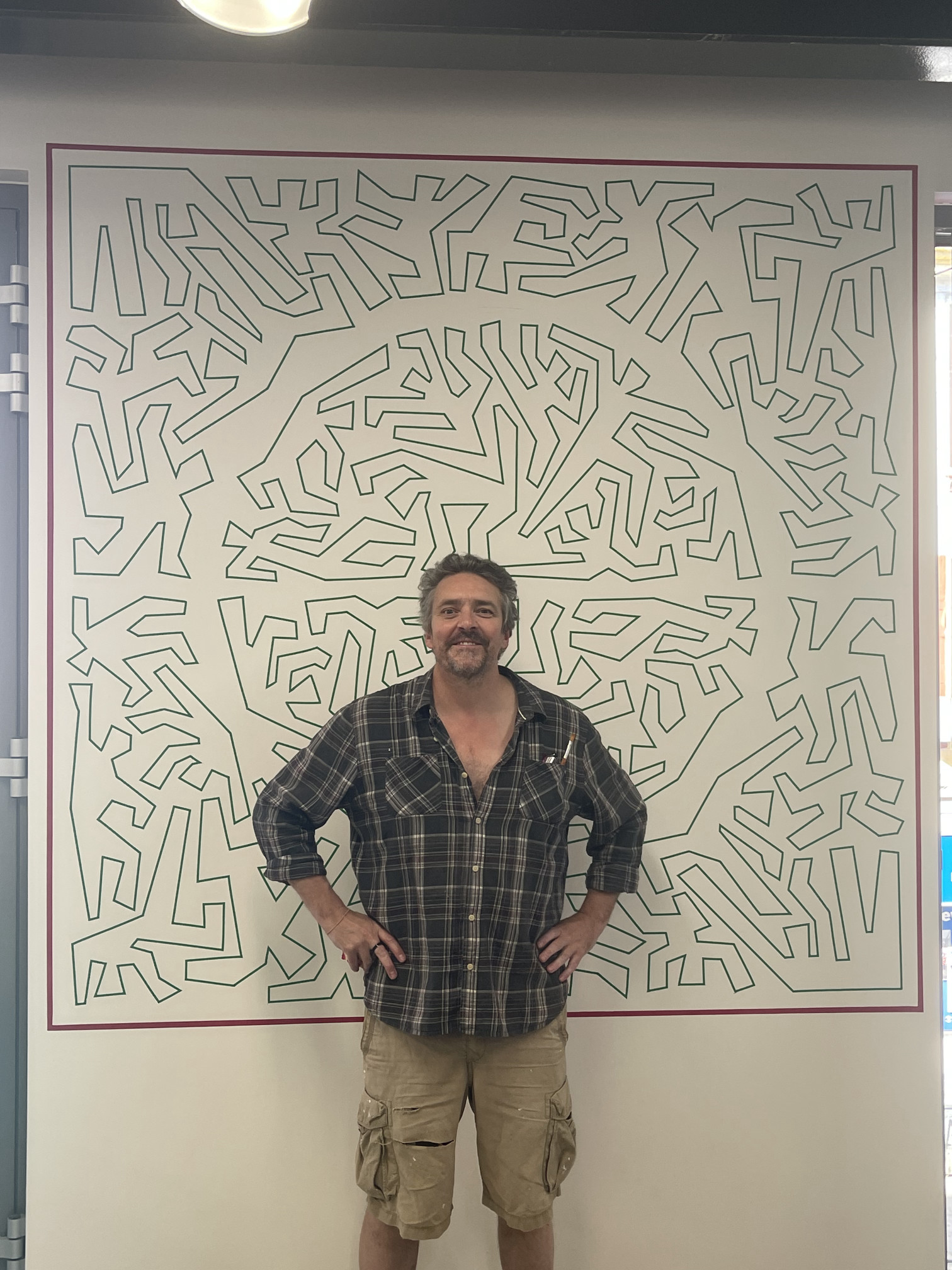 David Alderman with his mural