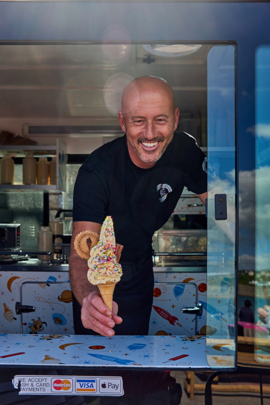 Graham Reynolds serving ice cream
